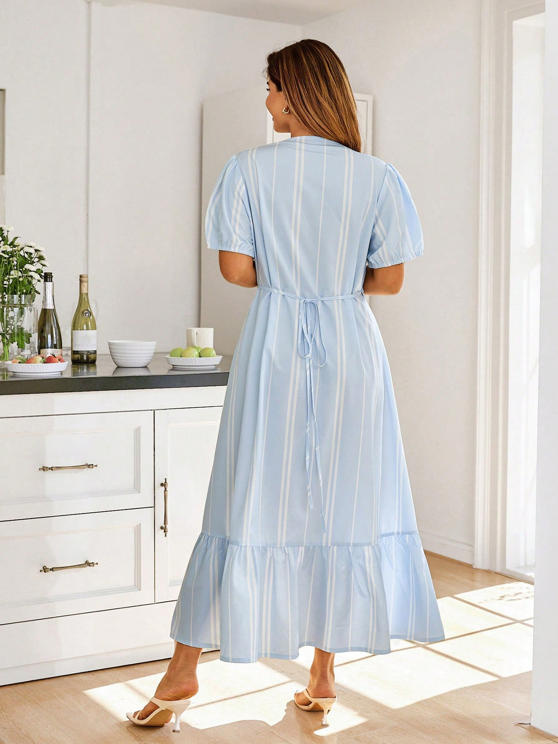 Step into sunshine with this playful plus size striped dress designed to turn heads. Featuring a flattering deep V-neck and a cinched waist, it beautifully highlights your curves while the ruffled hem adds a flirty finish. Light and breezy, it's your perfect summer companion for effortless style and comfort.