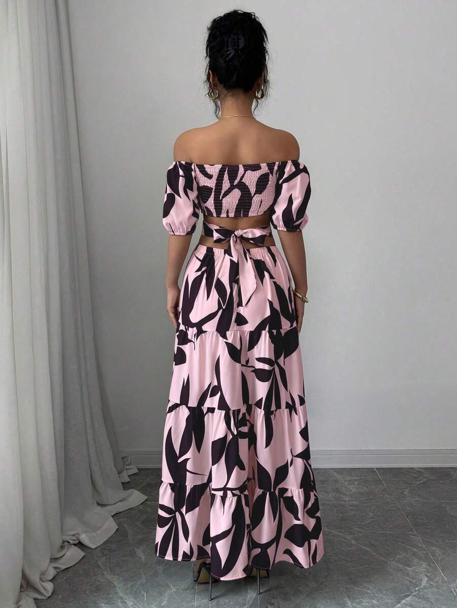 Escape to paradise in this charming off-shoulder dress that's practically begging for a vacation photo. The vibrant floral print brings instant tropical vibes, while the playful tie-up detail and asymmetrical hem add just the right amount of sass. Perfect for beach days, resort dinners, or anywhere you want to feel effortlessly chic and carefree. Slip it on and let the adventure begin!