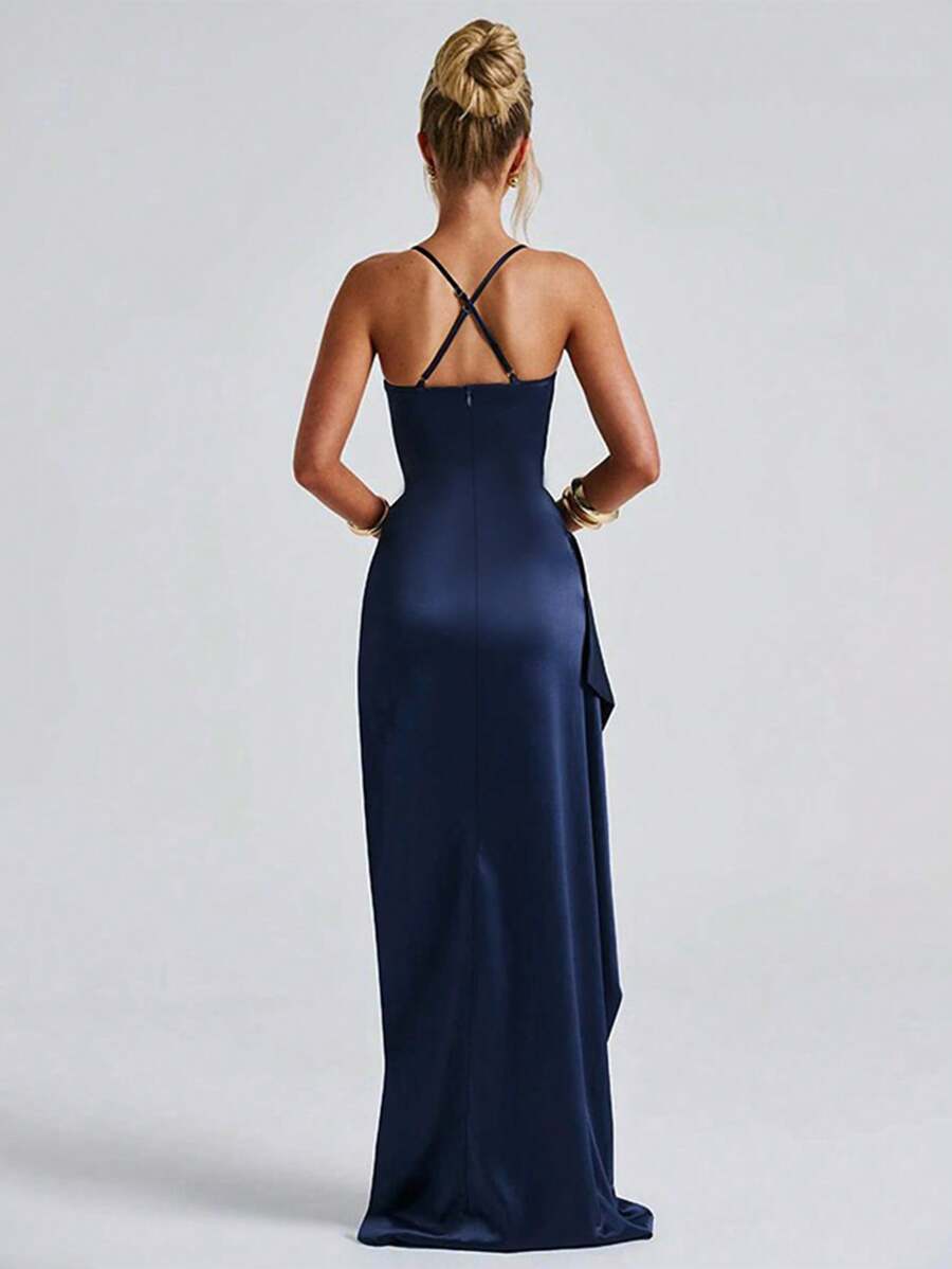 Black satin gown back view showing crossed straps and floor-length hem