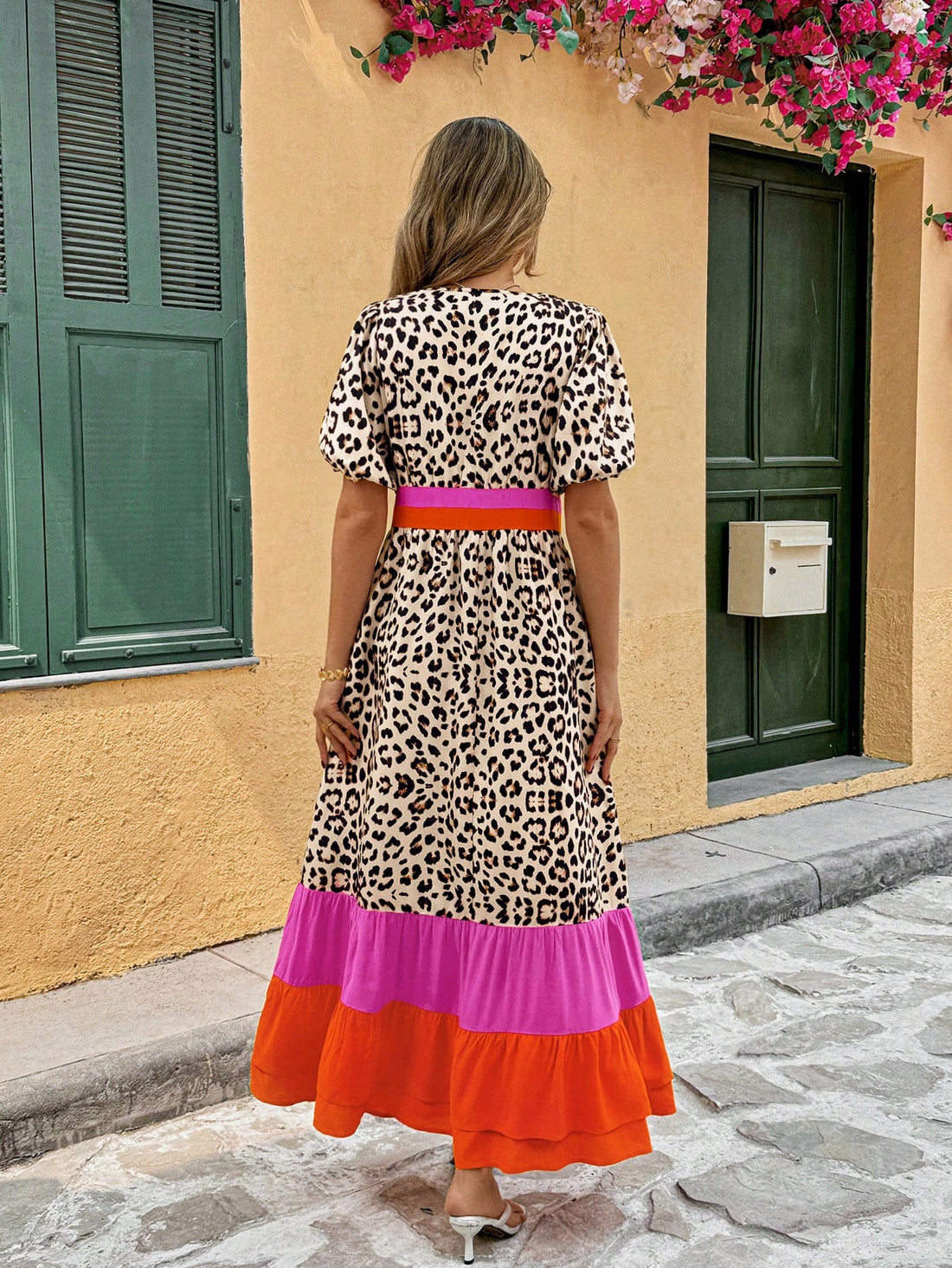 Unleash your wild side with our Trendy Women's Summer Dress! The loose fit and playful leopard print adds a touch of fun to your wardrobe. Featuring a bold pink striped color block and charming puff sleeves, this dress is perfect for a summer day out. (Meow!)