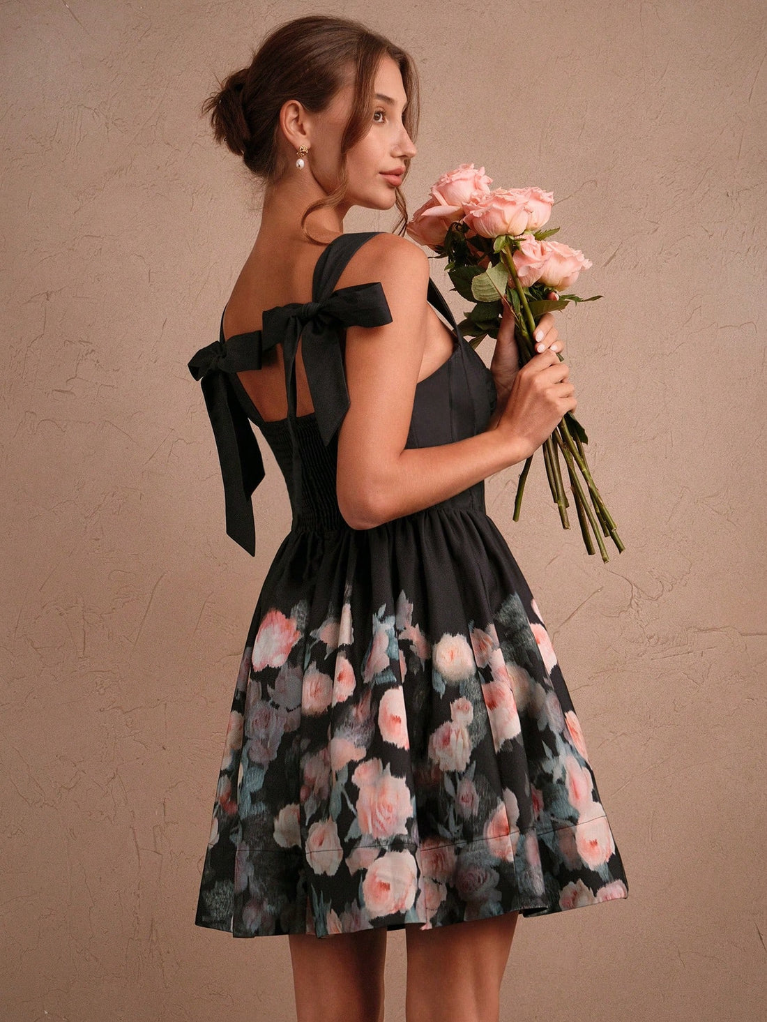 Step into spring and summer with a playful touch in this Elegant Rose Print Mini Dress. Featuring a charming bow tie and a flounce hem, it adds flair to every twirl. The delicate rose pattern brings fresh, feminine vibes, making it perfect for sunny days and garden gatherings. Light and breezy, this dress keeps you comfortable while turning heads with its sweet, stylish details.