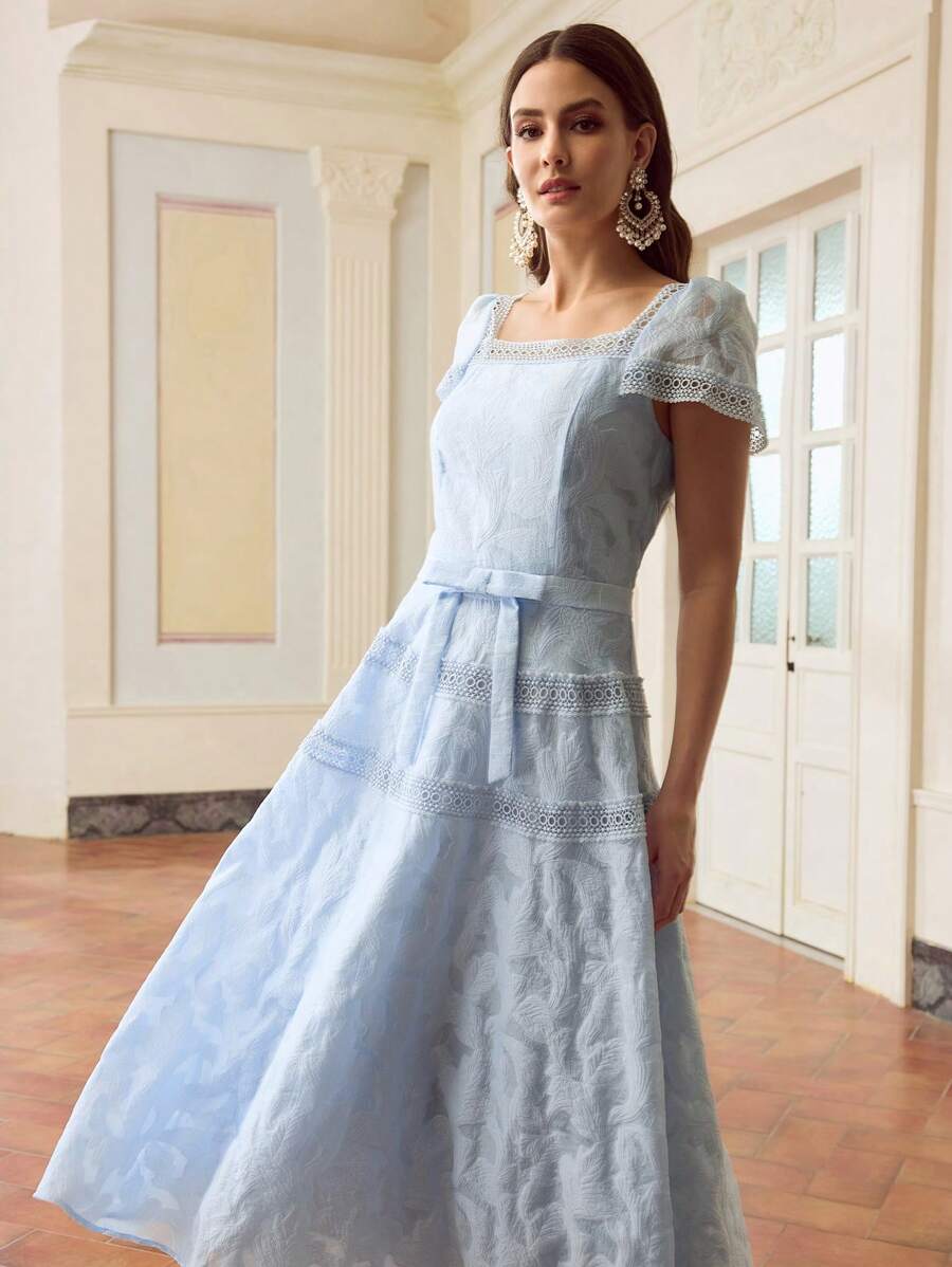 Step out in style with this Elegant Floral Lace Patchwork Ruffle Waist Dress. Its delicate lace and charming floral patchwork blend perfectly for a fresh summer vibe. The playful ruffle at the waist adds a fun twist, flattering your silhouette while keeping things light and breezy. Perfect for sunny days when you want to feel effortlessly chic and ready to dance through the season!