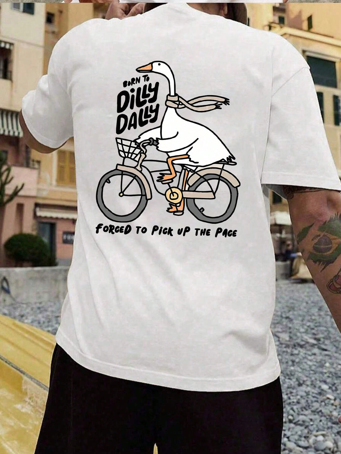 Make a statement with our "The Goose Is Forced to Speed Up" graphic tee! This playful short-sleeve t-shirt combines comfort and quirky humor for your spring and summer wardrobe. Soft fabric keeps you cool while the eye-catching design turns heads. Perfect for casual outings, beach days, or simply embracing your fun side when temperatures rise.