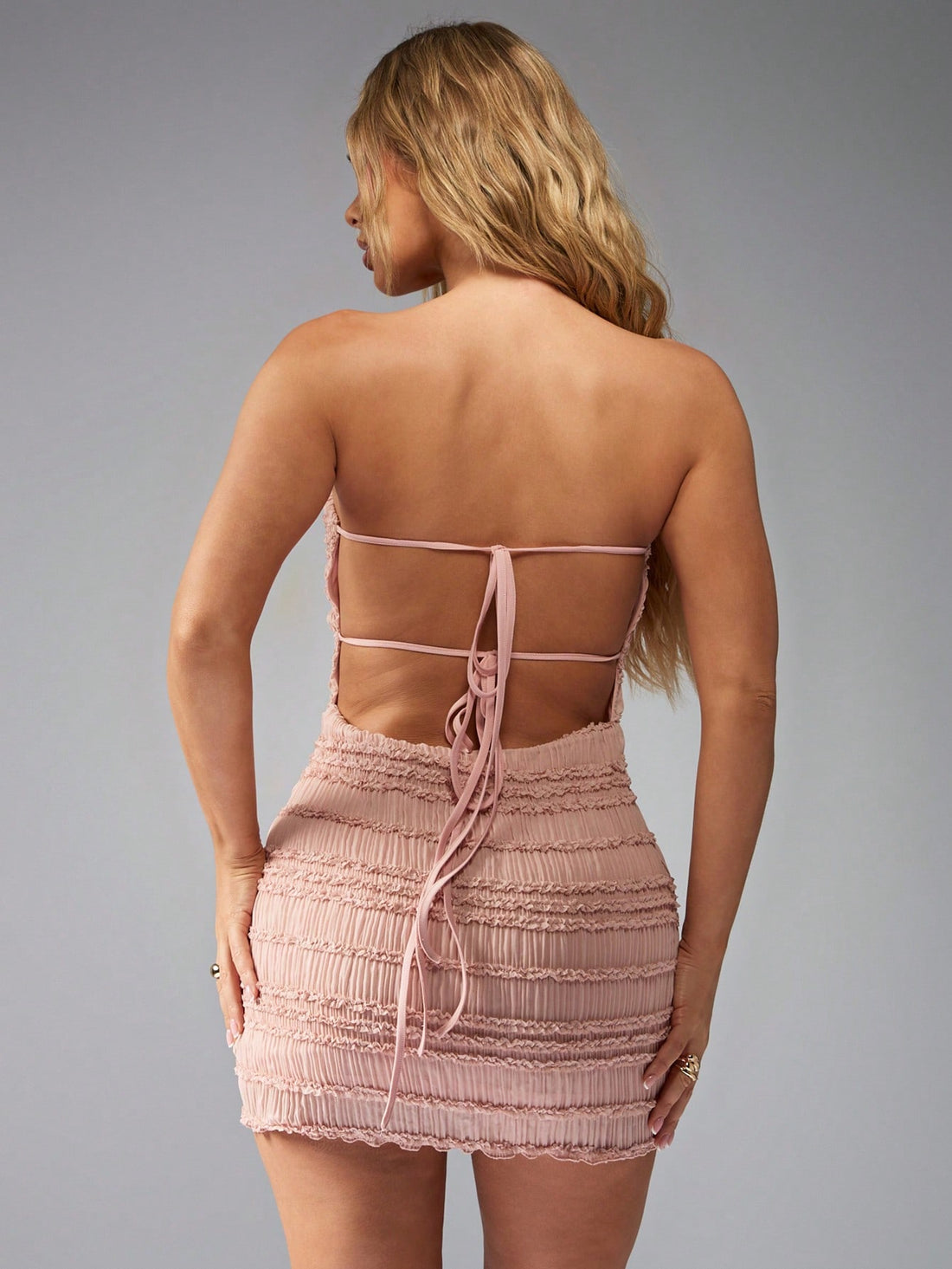 Turn heads at every summer party or wedding with this chic ruched strapless bandeau mini dress. Its flattering ruched detail hugs your figure, while the strapless design keeps things flirty and fun. Perfect for dancing the night away or soaking up the sun in style, this dress brings effortless charm wherever you go.