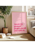 Close-up of pink motivational typography wall art with star accent