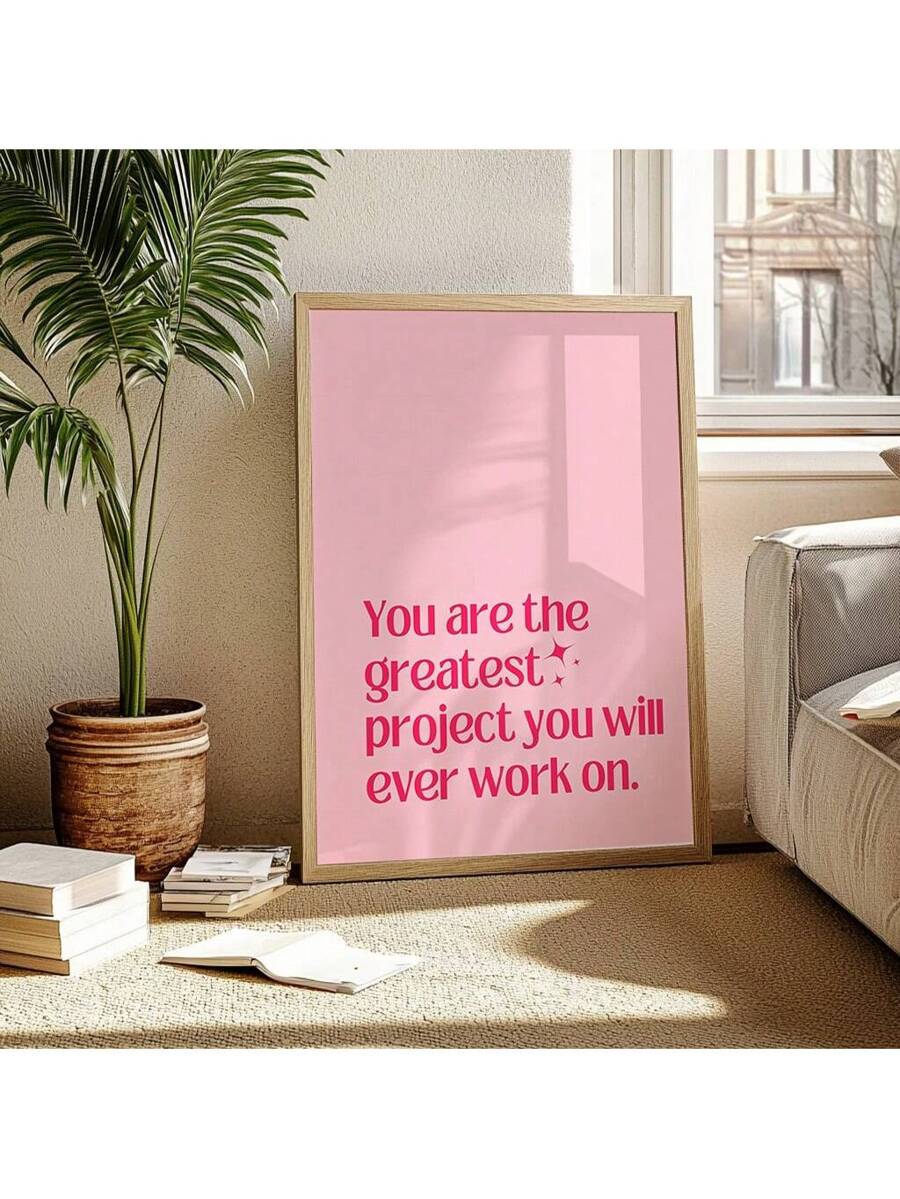 Close-up of pink motivational typography wall art with star accent