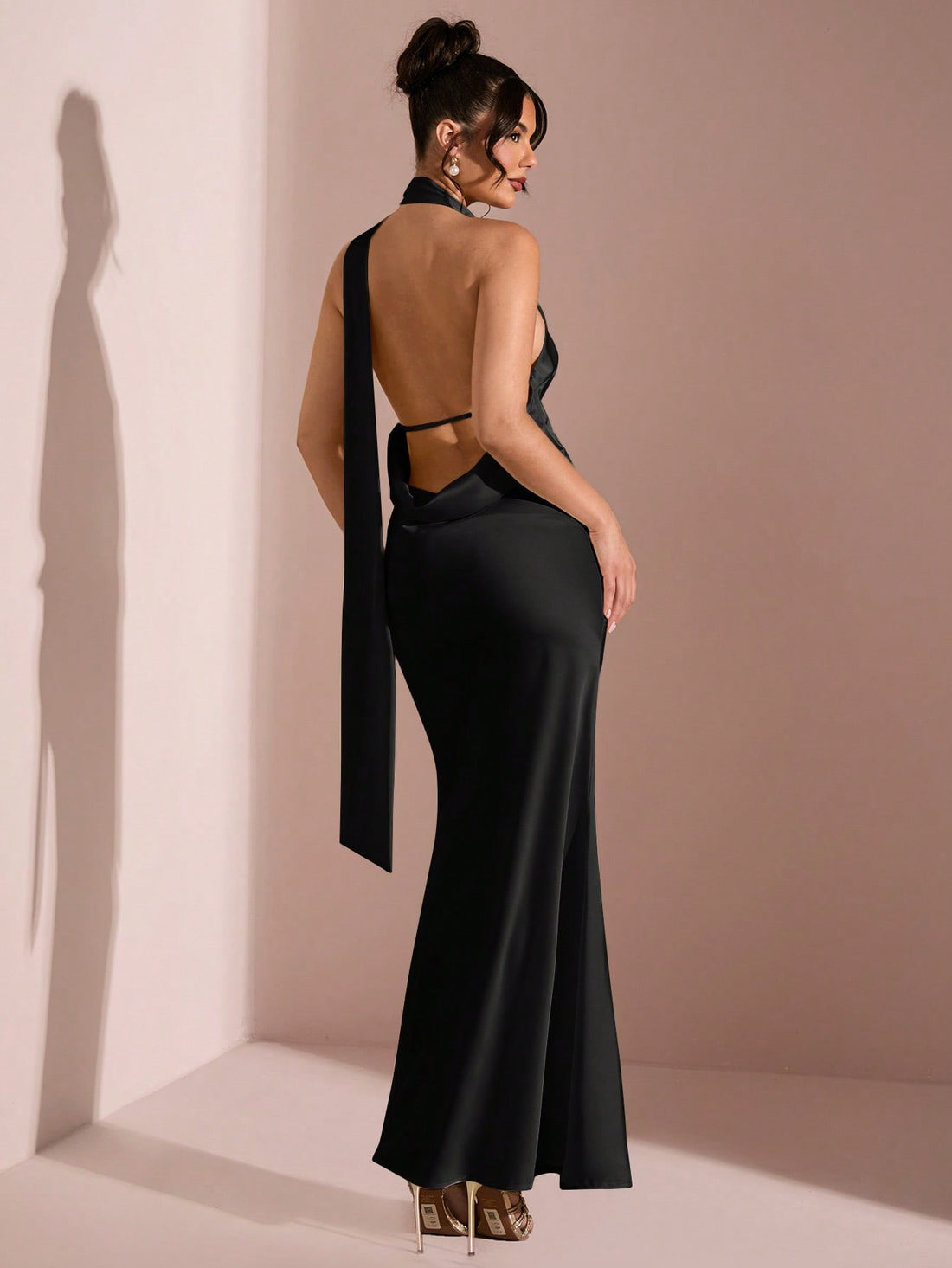 Be the sunshine at any spring or summer occasion with our Elegant Yellow Satin Backless Maxi Dress. The halter tie adds a touch of playfulness to this stunning and comfortable dress. Perfect for those looking to make a statement with style and fun (while staying chic, of course!).