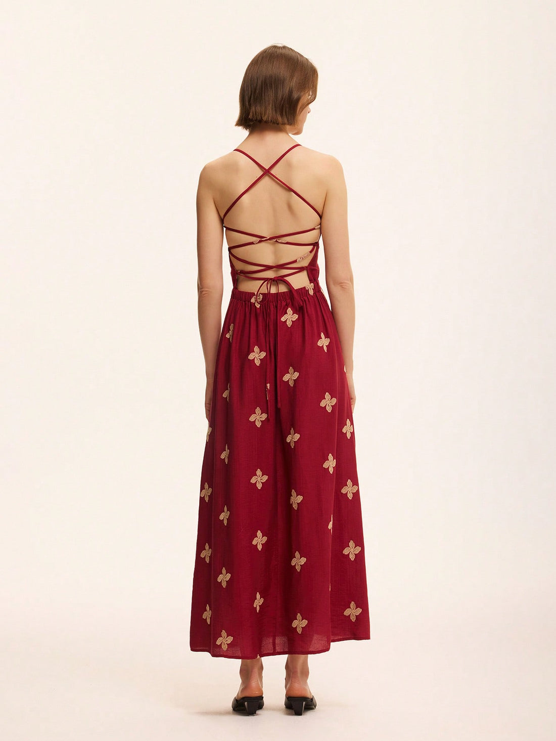 Step out in style with this playful A-line dress featuring delicate floral embroidery and a charming tie-back detail. Its flattering silhouette offers comfort and casual chic vibes, perfect for sunny days or casual gatherings. Embrace effortless elegance with a touch of whimsy in every wear.