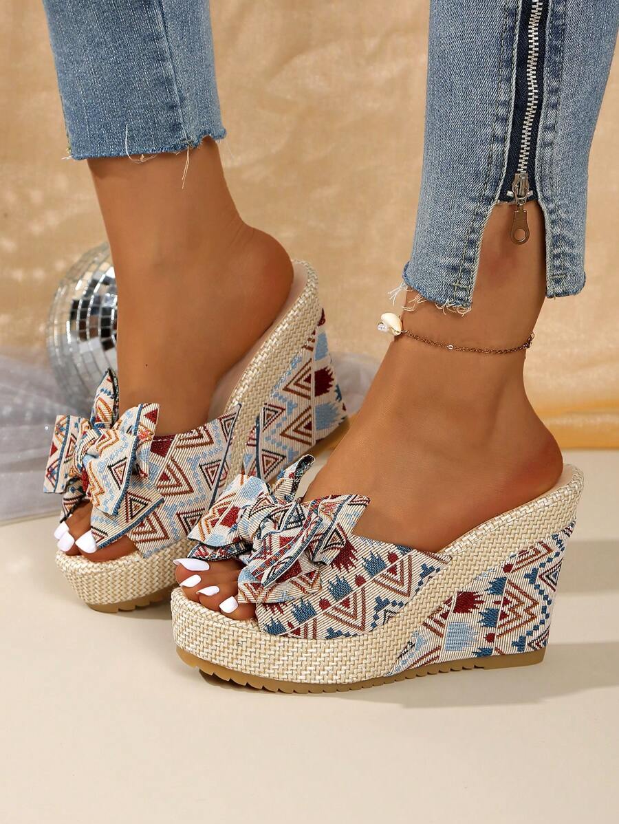 Step out in style with these Chic Women's Bowknot Wedge Heel Slide Sandals! Featuring a playful bowknot design and a comfortable wedge heel, they effortlessly elevate any outfit while keeping your feet happy all day long. Perfect for adding a fun, flirty touch to your look with ease.