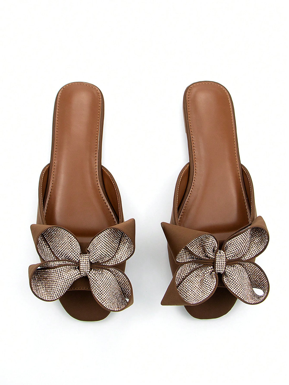 Step into style with our Wine Red Rhinestone Flower Bow Flat Mules! These sassy sandals bring the party wherever you go with their eye-catching rhinestone flower bow. Crafted from comfy Lycra that hugs your feet just right, they're your new BFFs for both casual days and nights out. Who says you can't dance all night in flats? These mules prove you absolutely can!