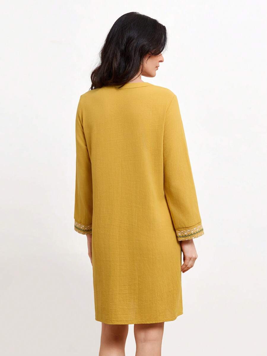 Get ready to turn heads with this elegant dress featuring delicate floral embroidery and a unique notched neckline. Perfect for any occasion, this dress is the epitome of effortless style. Dress to impress in this stunning piece that is sure to make you stand out from the crowd!