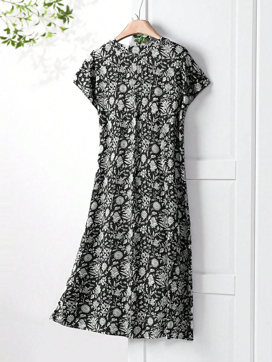 Experience the perfect blend of chic and playful in our V-neck floral print midi dress for women. With its vibrant floral pattern, this dress is the perfect choice for spring and summer events. The v-neckline adds a dash of elegance while the midi length keeps it modern. Get ready to turn heads and embrace the sunny season in style!