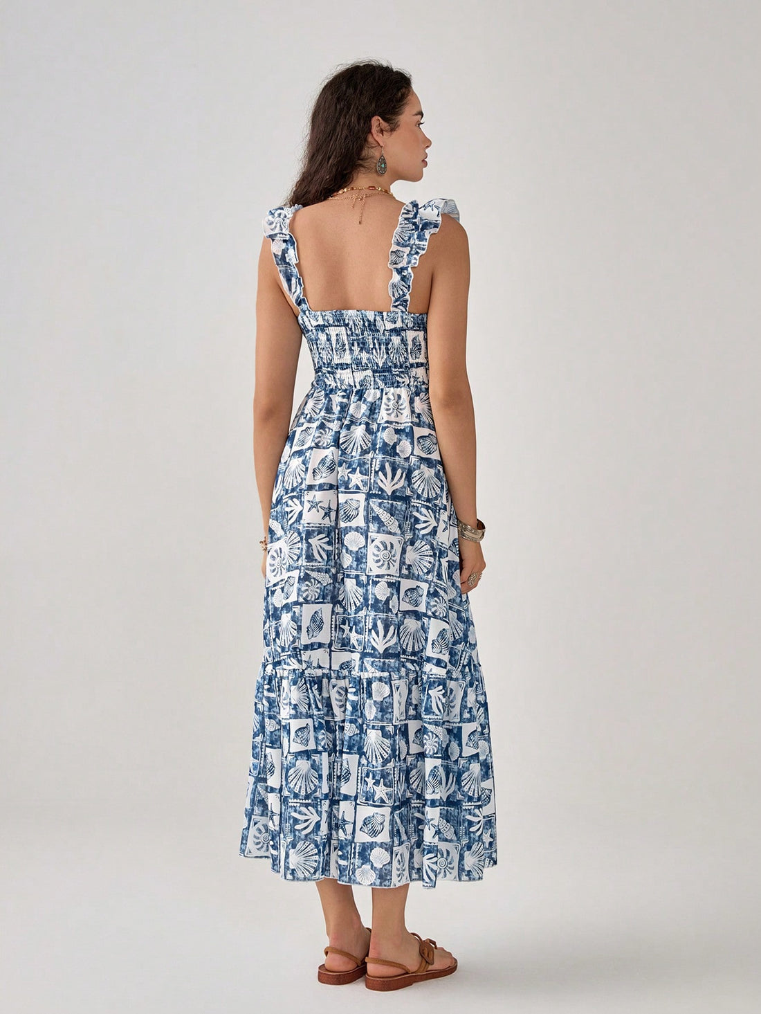 Slip into seaside chic with our Blue Shell Print Dress! This breezy slip silhouette features a whimsical ocean-inspired pattern that's ready to make waves in your wardrobe. Perfect for sunny brunches or beachside strolls, it's the no-fuss fashion fix that lets you look put-together without even trying. Just throw it on and go—instant style points guaranteed!