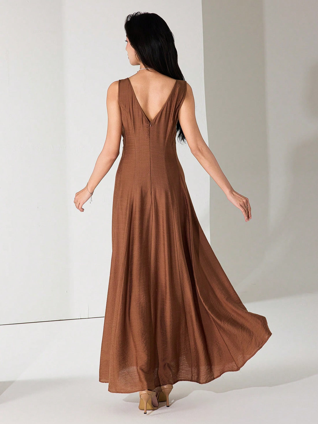 Twirl into summer with our sleeveless flared hem dress that's equal parts elegant and fun! This breezy number keeps you cool during warm days while the flattering silhouette ensures you'll stand out at any graduation ceremony. From accepting diplomas to celebrating afterward, this versatile dress transitions effortlessly from formal moments to casual festivities!