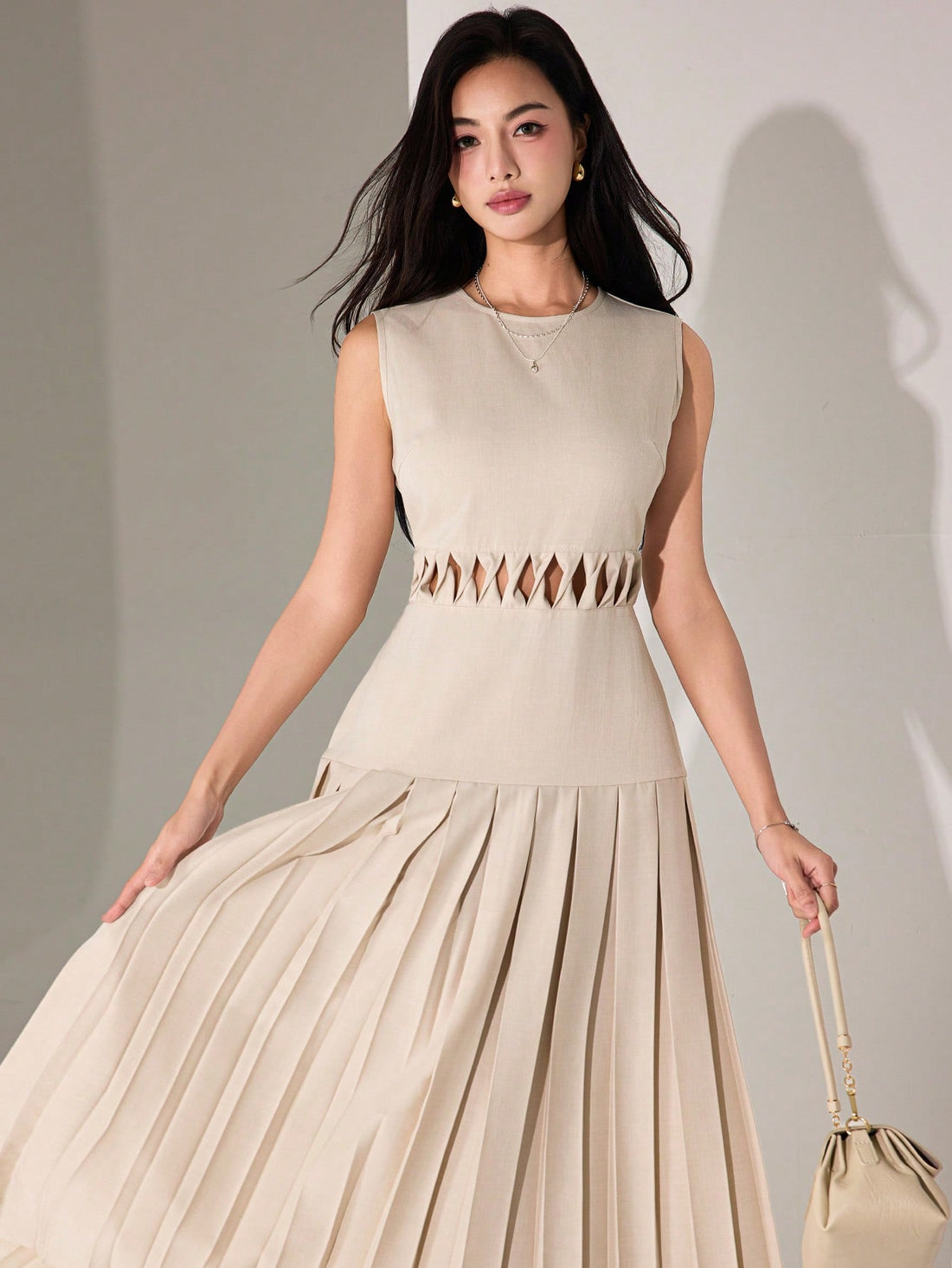 Twirl into summer with our sleeveless dress that's equal parts flirty and fabulous! The eye-catching hollow waist detail creates a stunning silhouette, while the playful pleated hem dances with every step. Perfect for turning heads at garden parties or making everyday errands feel like a runway moment!