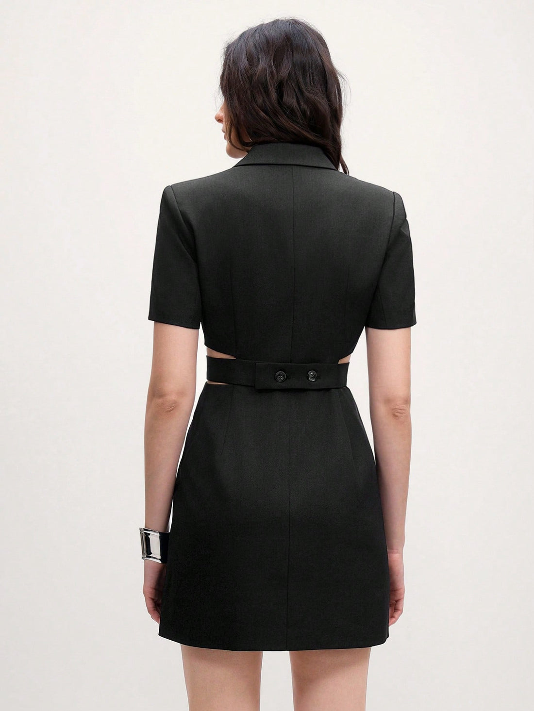 Step out in style with this chic black lapel shift dress, designed for effortless casual flair. Featuring short sleeves and a playful hollow-out detail, it adds a touch of fun to your look. The button waist cinches just right, flattering your silhouette while keeping comfort front and center. Perfect for any occasion where you want to feel both relaxed and fabulous.