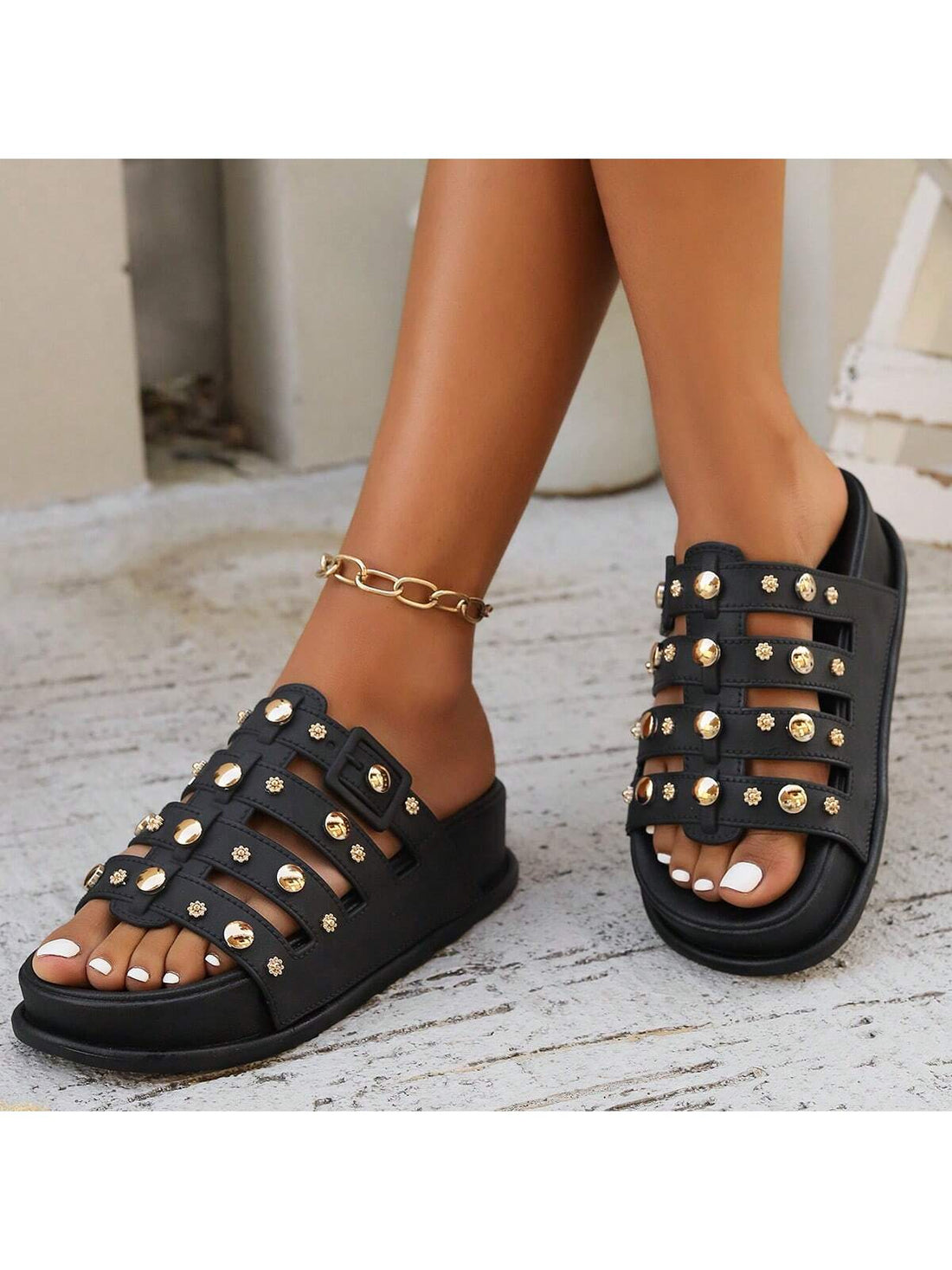 Step into summer with these eye-catching leather sandals! The playful rivet embellishments add a touch of edge to your casual look, while the convenient slip-on design makes them your go-to choice for sunny days. The mid heel offers just the right amount of lift without sacrificing comfort. These versatile slides will jazz up everything from sundresses to your favorite jeans!