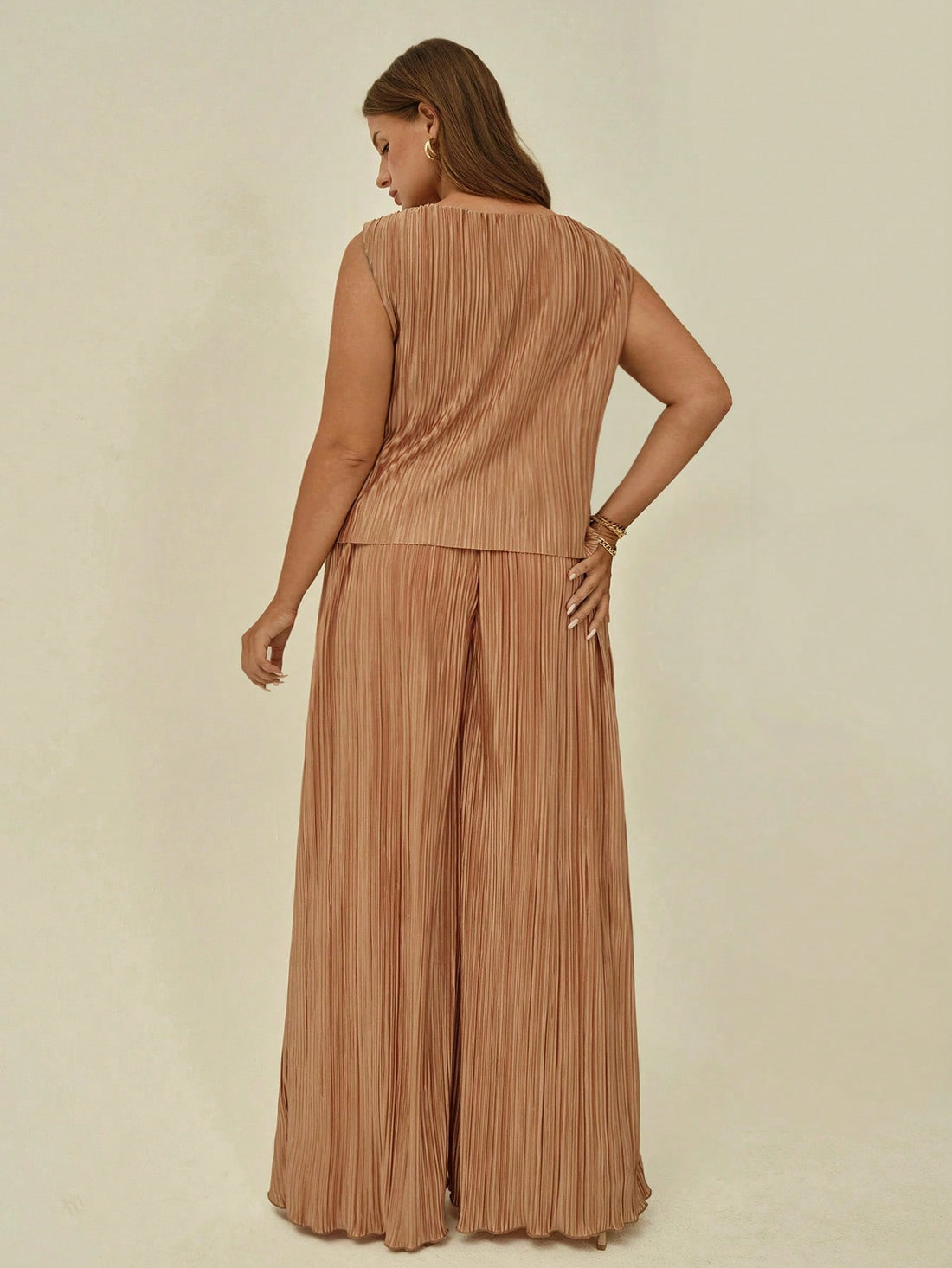 Elevate your wardrobe with this fabulous 2-piece set that's ready for anything! The lightweight vest pairs perfectly with flowing wide-leg trousers, creating an effortlessly chic silhouette that flatters and moves with you. Whether you're conquering the office or jet-setting on vacation, this versatile combo transitions seamlessly from boardroom to beachside. Designed for comfort and style, it's the ultimate power move for anyone who refuses to compromise on looking absolutely stunning.