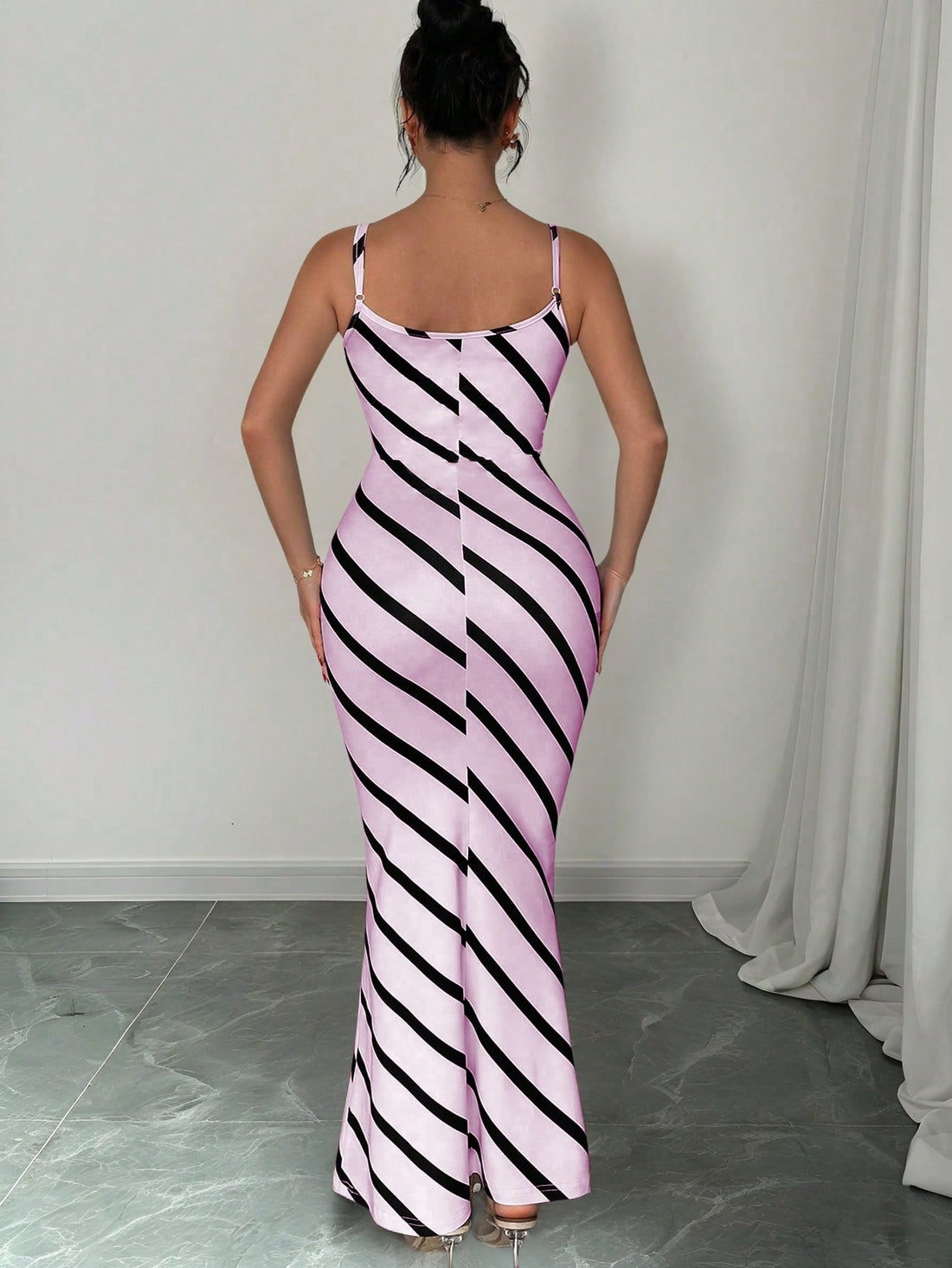 Get ready to turn heads in this elegant extra long purple striped dress! Perfect for both commuting and special occasions, this fitted dress features a flattering strap design that will highlight your figure. Whether you're on the go or dressing up, this dress is sure to make a statement.