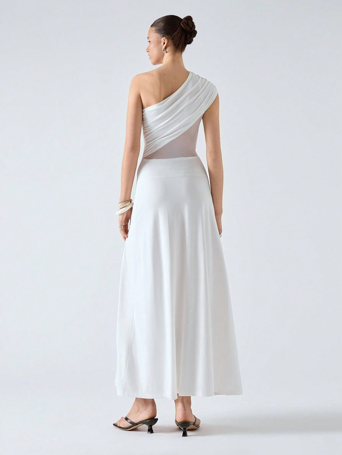 Turn heads this season with our playful one-shoulder ruched dress, designed to flatter every curve with stylish paneling. Perfect for spring and summer 2025, this dress combines comfort and chic in one effortlessly elegant look. Whether you're out for brunch or dancing the night away, it’s your go-to for fun, flirty fashion.