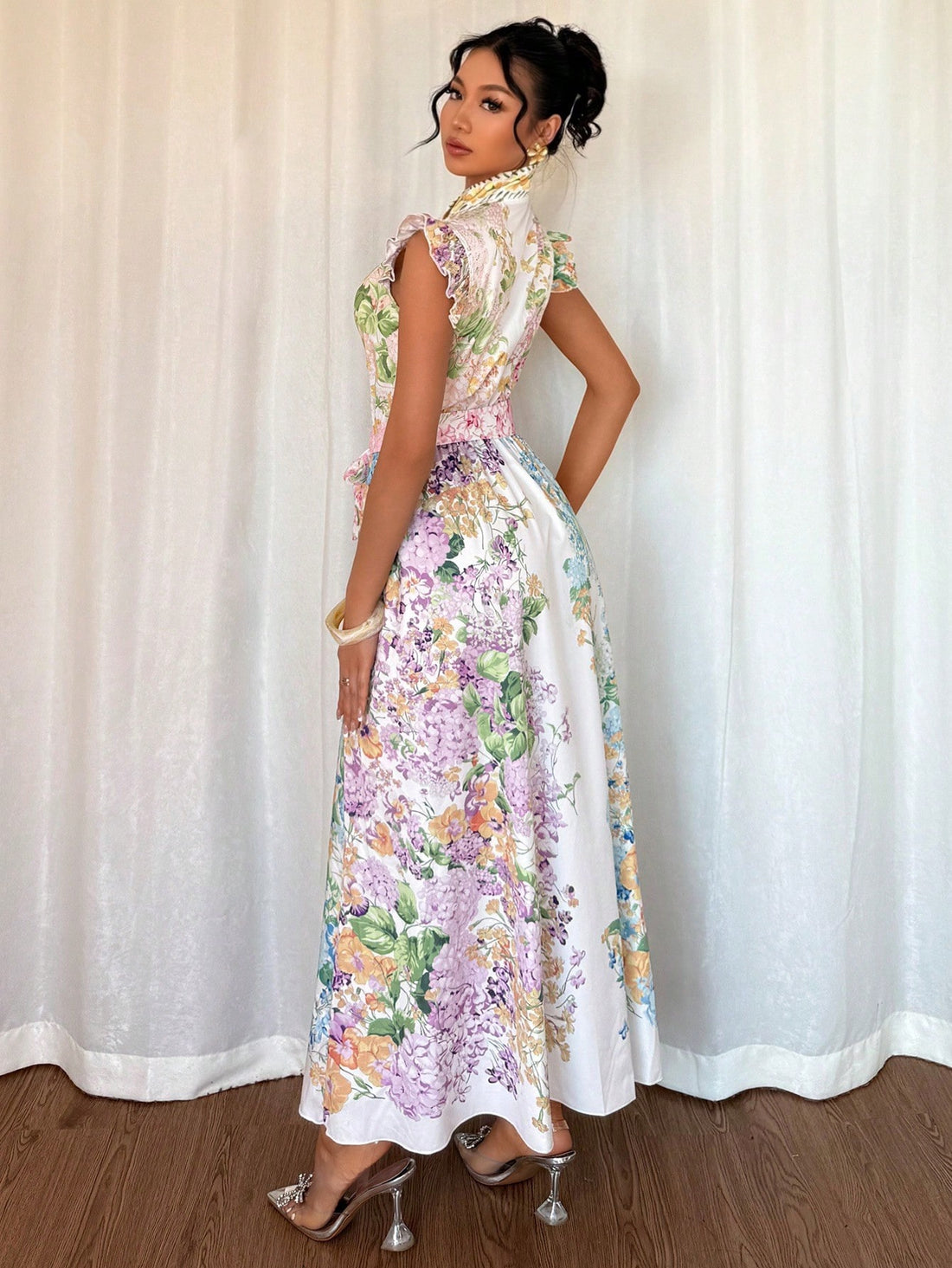 This whimsical floral print dress combines puff sleeves with a stand collar for a look that's both fun and sophisticated! Perfect for twirling through summer days or making an entrance at casual gatherings. The long silhouette keeps you feeling breezy and looking fabulous, while the charming pattern adds a pop of personality to your warm-weather wardrobe.