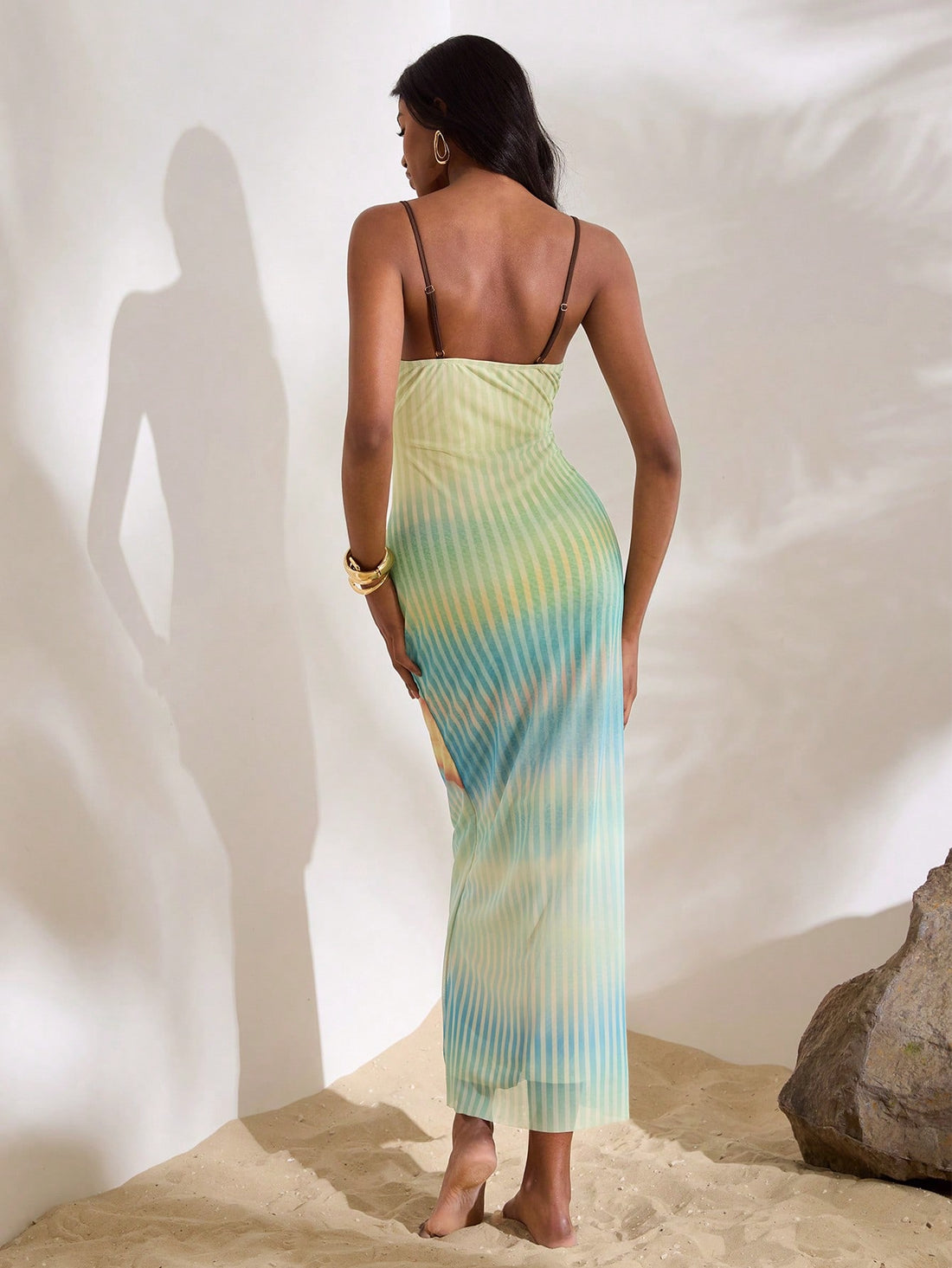Step into sunshine with this playful sleeveless maxi dress, featuring a soft rib knit fabric and a vibrant floral print perfect for beach days or casual outings. Its breezy design keeps you cool while adding a splash of fun to your summer wardrobe. Effortless style meets comfort in one flirty, flowy dress!