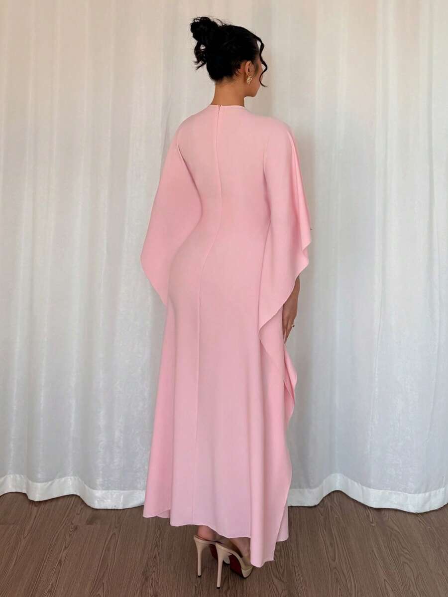 Get ready to turn heads and make a statement with our Elegant Draped Neck Batwing Sleeve Long Dress Robe. Perfect for the stylish and playful fashionista, this dress is perfect for spring/summer days. Its flattering draped neck and batwing sleeves add a touch of elegance to any outfit. Get ready to slay in style!