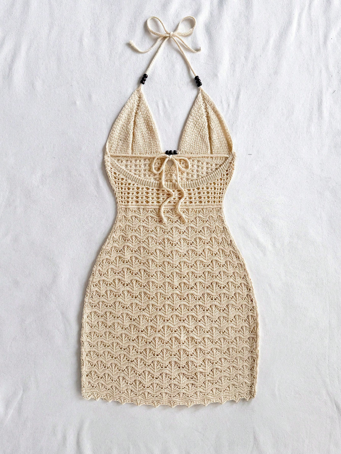 Get ready to be the envy of everyone at your next vacation or festival with this chic and playful bodycon dress! The spaghetti straps and wooden bead details add a touch of flair to this perfect summer dress! (Warning: may cause excessive compliments and head-turning.)