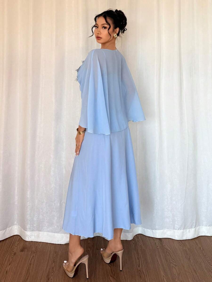 This elegant A-line dress is perfect for young ladies wanting to make a statement this spring and summer. The silver lace trim adds a touch of glamour while the chiffon shawl adds a hint of femininity. Step out in style with this eye-catching dress!