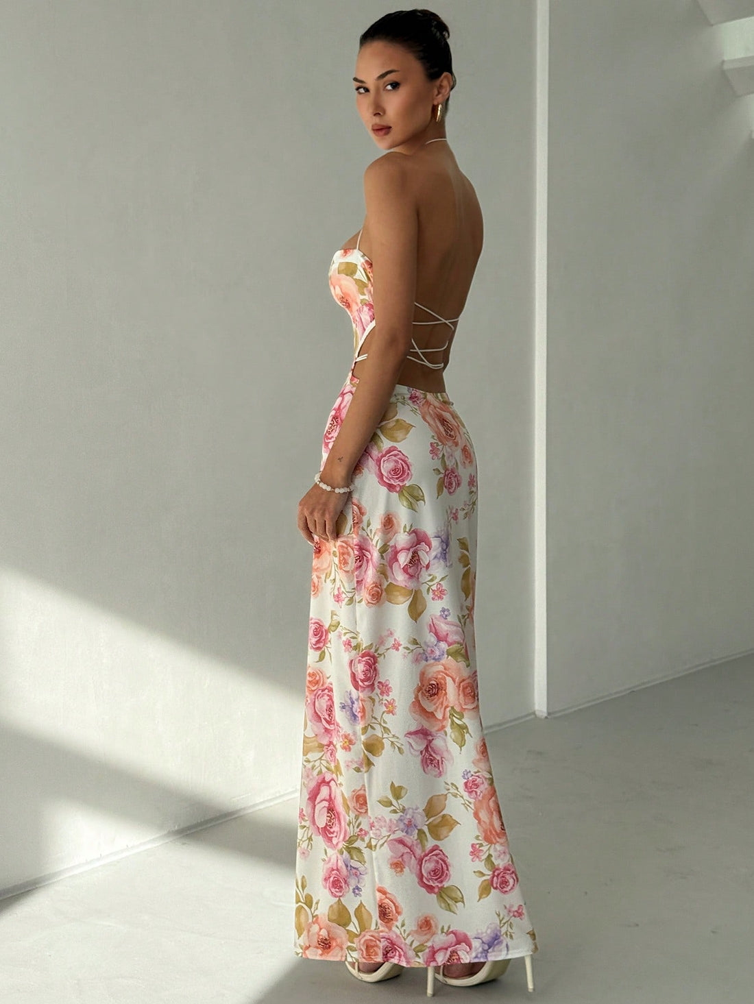 Turn heads this season in our stunning floral print backless dress—the ultimate beach vacation essential. This playful piece features a vibrant botanical design that captures the spirit of summer, paired with a daring open back that keeps things breezy and chic. Perfect for lazy beach days, sunset strolls, or evening gatherings, it's the one dress that transitions effortlessly from day to night. Lightweight and flattering, it's your new go-to for making a splash wherever the season takes you.