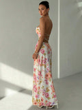 White polka dot halter maxi dress with black lace trim