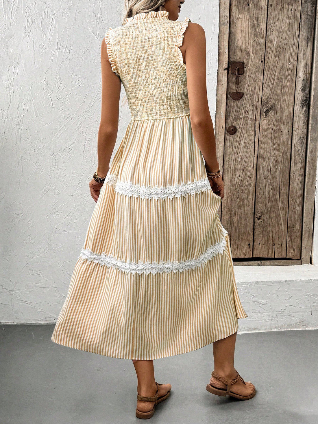 Effortlessly elevate your vacation style with our Chic Striped Lace Trim Casual Dress. With its sleeveless design and playful lace trim, this dress is perfect for a day out exploring or a night out on the town. Chic stripes add a touch of sophistication to this versatile and fun dress.