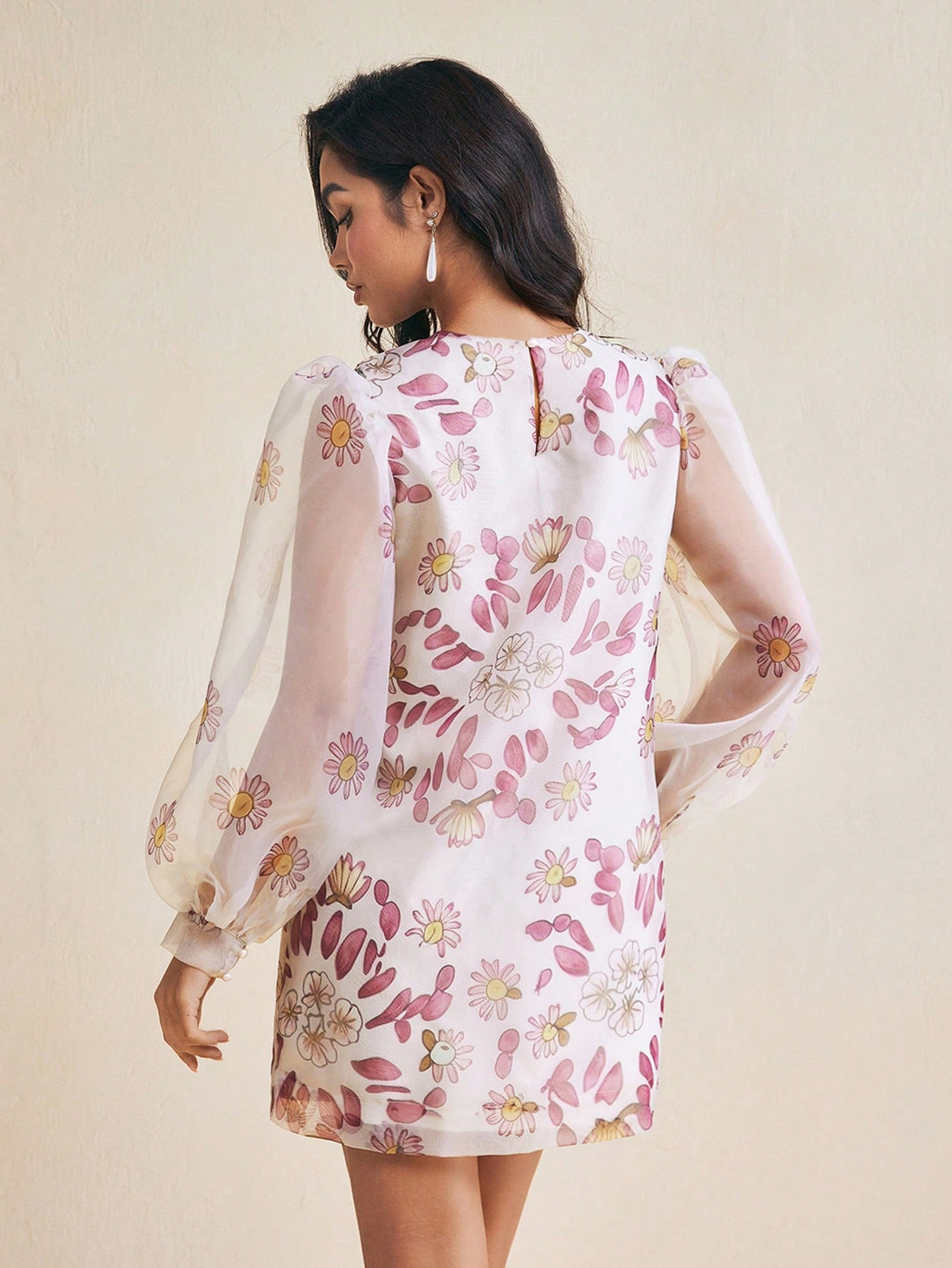 Step into spring and summer with this playful mini dress featuring a charming floral print and billowy bishop sleeves. Its flattering silhouette and breezy fabric make it perfect for romantic getaways or lively parties, adding a touch of whimsy to your warm-weather wardrobe.
