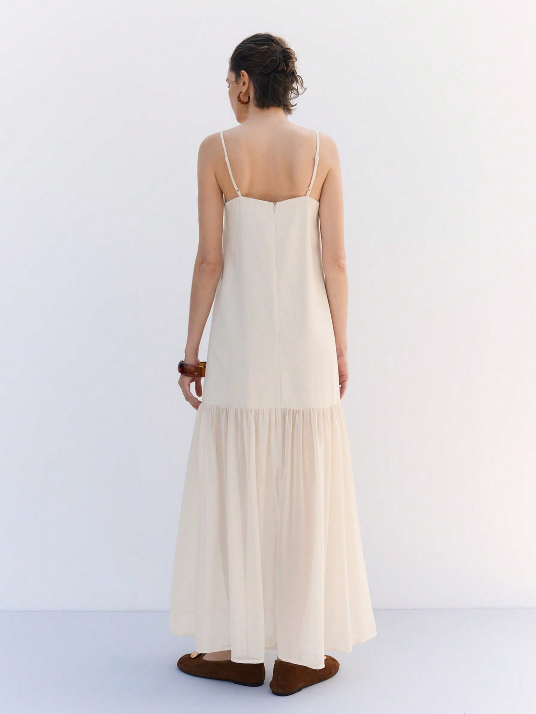 Step into sunshine with this Chic Solid Apricot Maxi Dress, featuring playful ruffle hems and delicate spaghetti straps. Perfect for spring and summer getaways, its breezy design keeps you cool while turning heads wherever you go. Embrace effortless style and vacation vibes in one flattering, flowy dress.