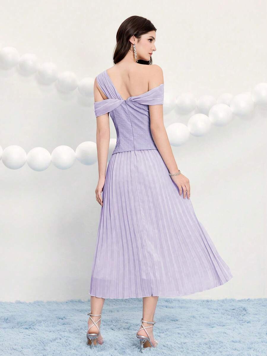 Step into the spotlight in this stunning jacquard dress designed for your most memorable moments. The gathered waist creates a flattering silhouette while delicate pleats add movement and dimension throughout. Crafted from luxurious jacquard fabric, this elegant piece transitions seamlessly from cocktail hour to prom night. Whether you're celebrating a special occasion or turning heads at a formal event, this dress delivers sophistication with a touch of playful charm. Perfect for anyone ready to make an un