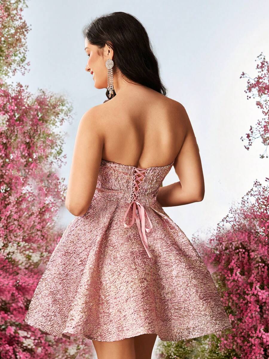 Step into the spotlight with this Elegant Vintage Pink Jacquard Glitter Tube Top A-Line Dress. Its shimmering jacquard fabric and playful glitter details add a touch of magic, while the flattering A-line silhouette ensures you dance through any special occasion with confidence and charm. Perfect for turning heads and making memories!