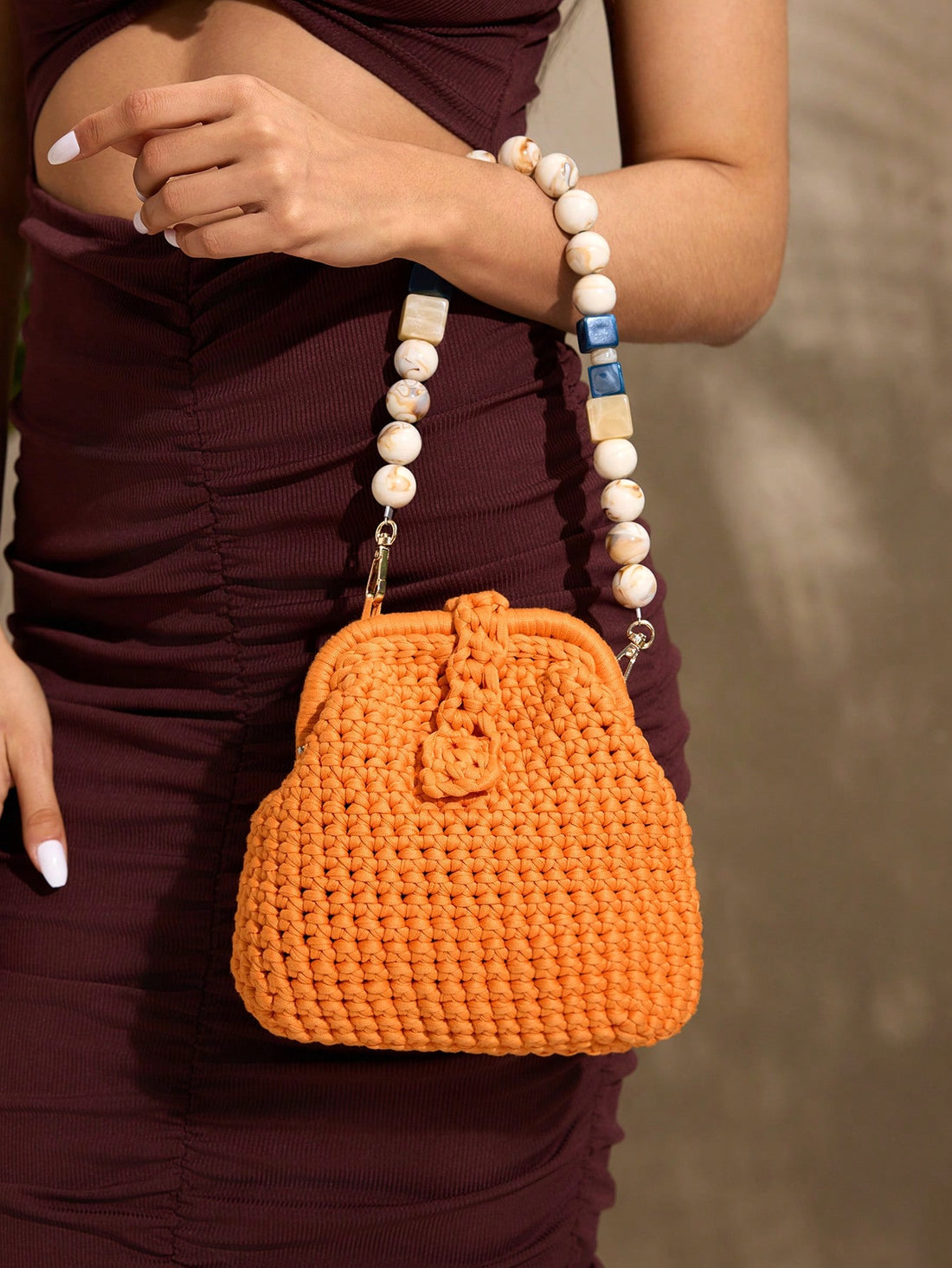Elevate your vacation wardrobe with this sophisticated crochet beaded shoulder bag. Handcrafted with meticulous attention to detail, the intricate crochet construction paired with delicate beading creates a refined aesthetic that transitions seamlessly from beach days to casual evenings. The spacious shoulder design offers comfortable, hands-free carrying while maintaining an elegant silhouette. Perfect for travelers seeking a versatile accessory that balances style with practicality, this piece combines ar