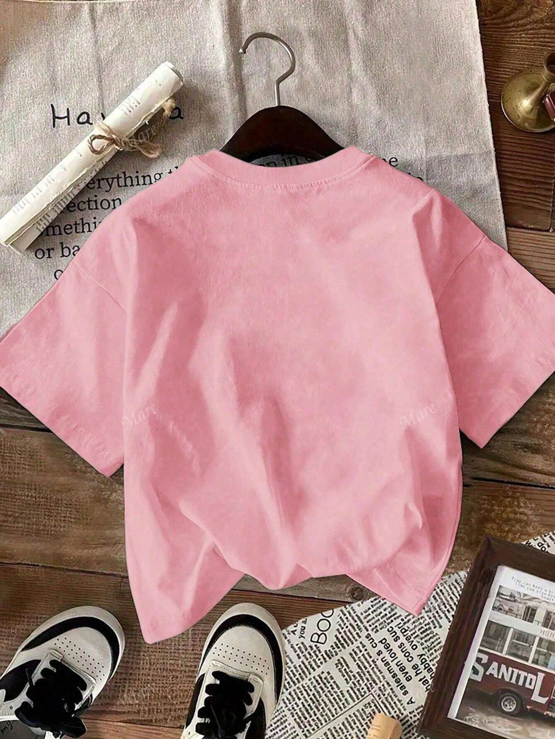 Indulge your fashion cravings with this trendy t-shirt featuring a mouth-watering croissant print. Made with a comfortable round neck and short sleeves, this casual tee is perfect for any occasion. A must-have for any fashion-forward woman! (Hungry yet? Get ready to satisfy your style cravings with this croissant t-shirt!)