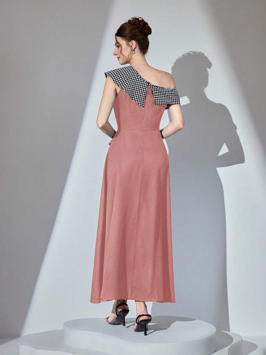 Step into sophistication with this stunning houndstooth pink dress that's anything but ordinary. The asymmetrical collar adds an unexpected twist, while the cinched waist flatters your silhouette and flows into a graceful A-line skirt. Perfect for elevating your everyday style or turning heads at special occasions, this long dress combines timeless houndstooth charm with modern design details. Whether you're dressing up for brunch or an evening out, this piece proves that classic patterns never go out of st