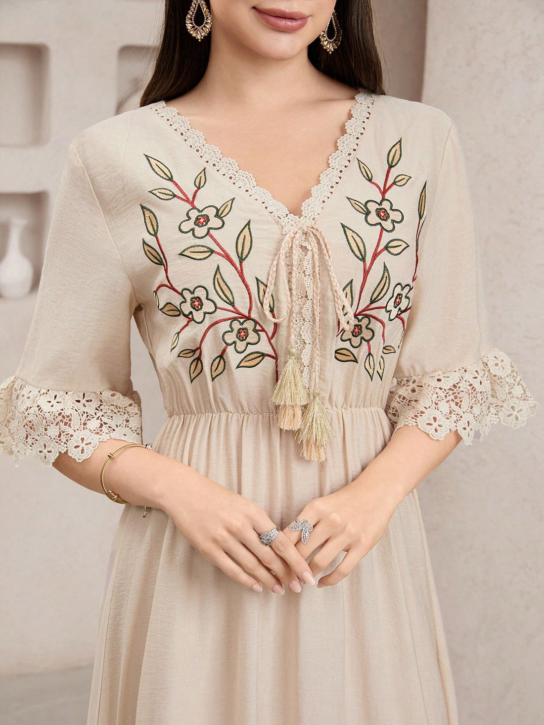 Twirl into summer with our Boho Floral Embroidery Long Dress! Delicate embroidered flowers dance across flowing fabric, while pretty lace trim adds that perfect touch of whimsy. This free-spirited maxi is your ticket to effortless style whether you're beach-hopping or sipping sunset cocktails on vacation. Embrace your inner flower child!