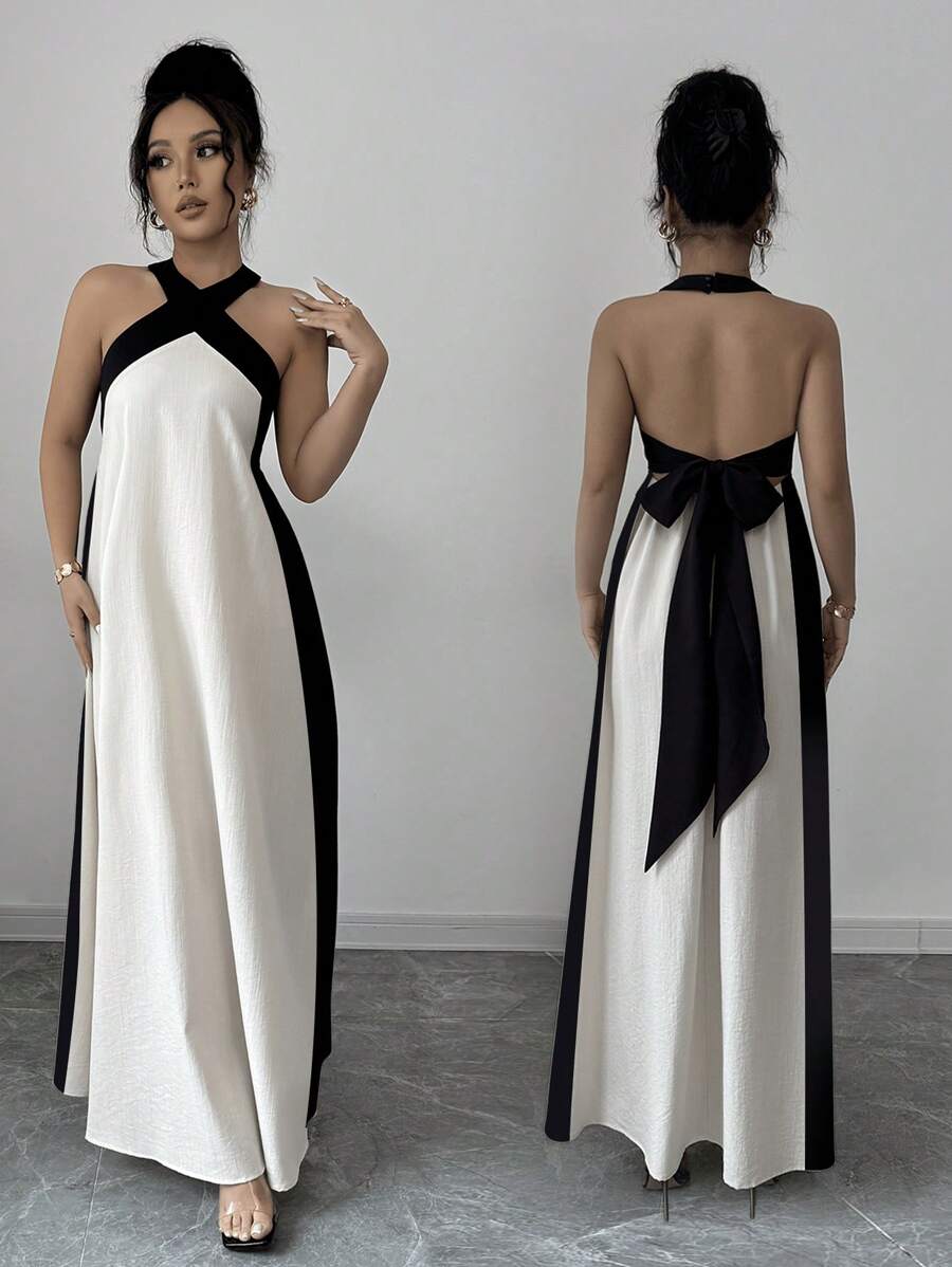 Step into summer fun with this vibrant Women's Bohemian Colorblock Halter Dress. Its playful mix of colors and breezy halter design keep you cool and stylish at every festival, beach day, or backyard party. Lightweight and flattering, it lets you move freely while turning heads wherever you go. Add a splash of carefree charm to your wardrobe with this effortlessly chic dress.