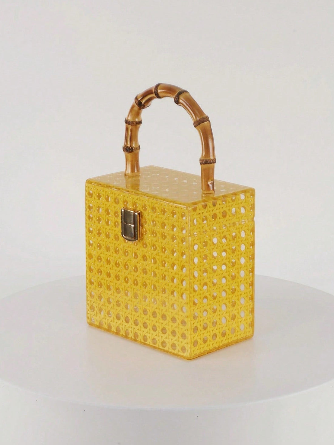 Elevate your style with this Chic Retro Acrylic Handbag, featuring a charming bamboo handle and a sleek metal lock. Perfectly sized for daily adventures or vacation fun, this playful accessory adds a splash of vintage flair to any outfit while keeping your essentials secure and within reach.