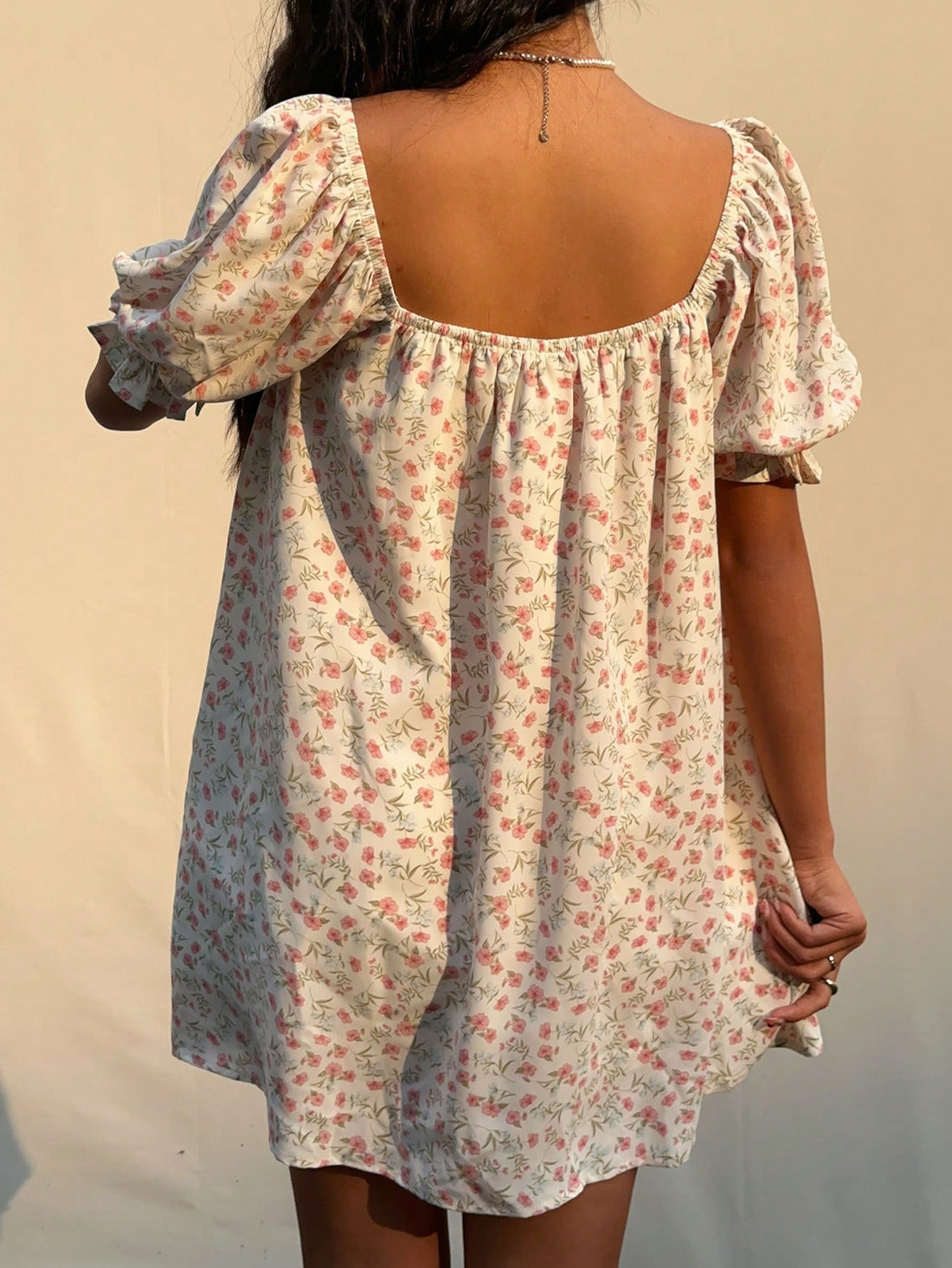Step into sunshine with this Charming Ditsy Floral Mini Dress! Featuring a flirty square neckline and playful puff sleeves, it’s the perfect pick for breezy summer days. The delicate floral print adds a touch of whimsy, while the mini length keeps your look fresh and fun. Effortless style has never been so charming!