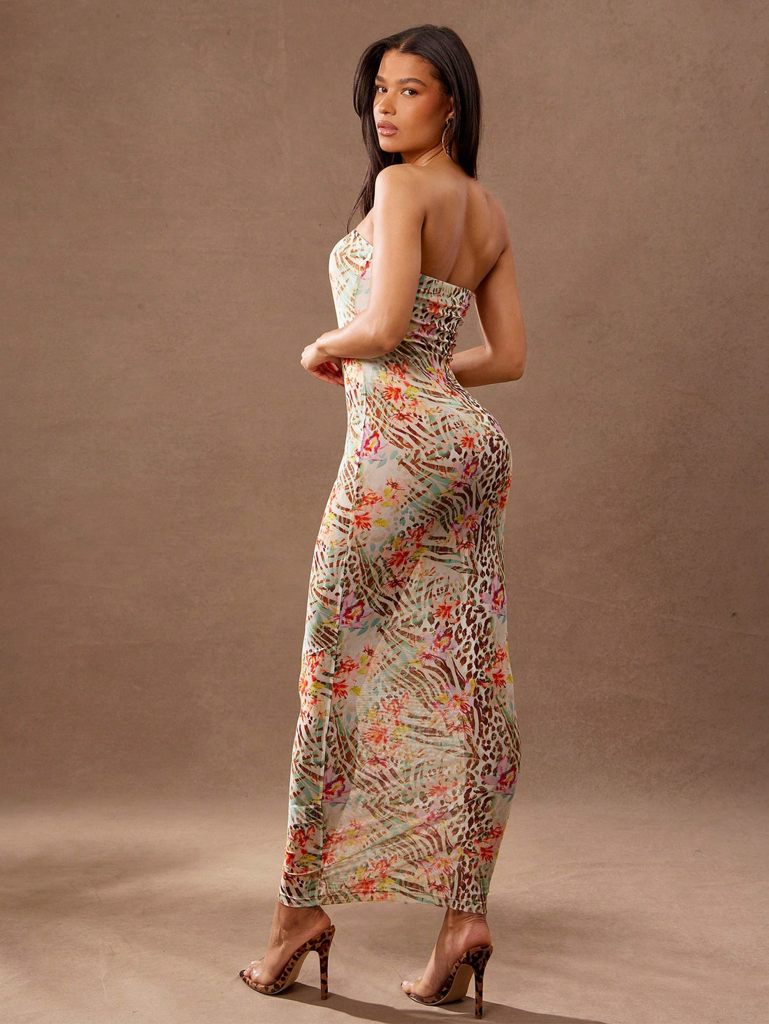 Unleash your wild side with our Chic Leopard Floral Print Maxi Cami Dress! This stylish and fitted dress is perfect for summer fashion. Embrace the double meaning of "fitted" and show off your fierce fashion sense. Get ready to slay in this quirky and playful outfit!