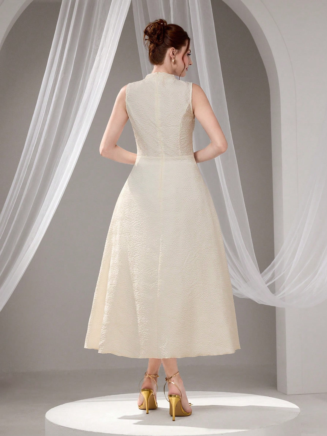 Make a statement at your next special occasion in this stunning sleeveless cocktail dress. Featuring eye-catching metal accents that catch the light beautifully, this elegant piece transitions seamlessly from graduation ceremonies to evening celebrations. The sophisticated silhouette flatters every figure, while the metallic details add just the right touch of glamour without overwhelming your look. Whether you're dancing the night away or posing for photos, you'll feel confident and radiant in this versati