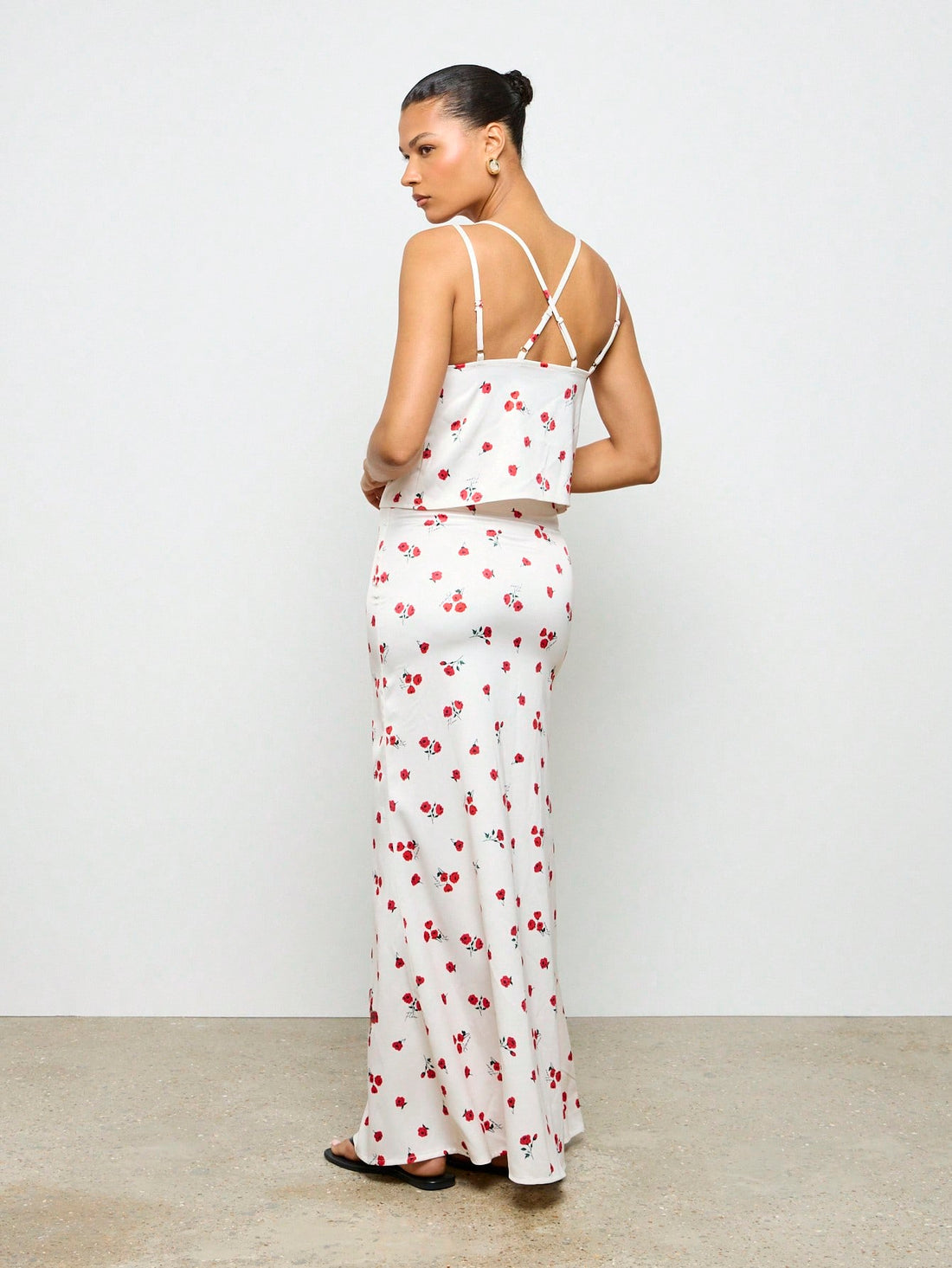 "Get ready to bloom this summer with our Cherry Blossom Floral Two-Piece Set! Featuring a perfect ruched cami top and maxi skirt, this set is perfect for your next resort getaway. Embrace the playful vibes with this unique and stylish ensemble. (P.S. It's also great for twirling under cherry blossom trees!)".
