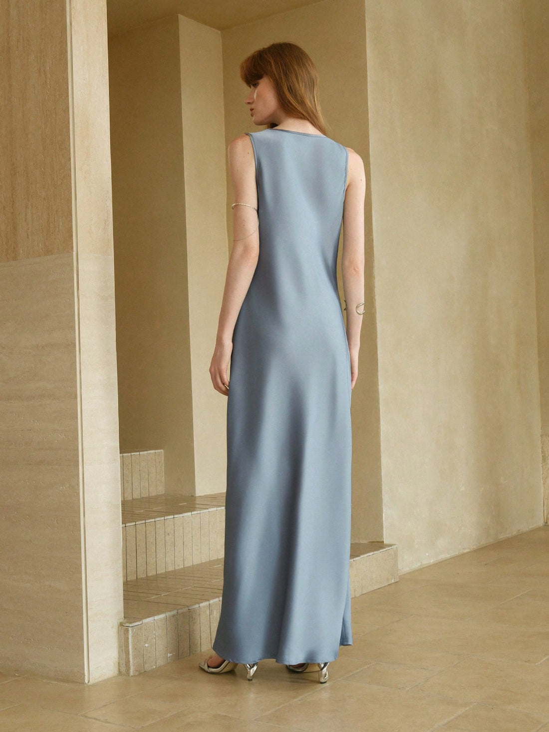 Step into summer soirées with this Elegant Gray-Blue Satin Maxi Dress, designed to turn heads with its playful asymmetric shoulder and flattering cinched waist. The silky satin drapes effortlessly, making it your go-to for cocktails or holiday evenings where effortless charm and a hint of mischief are on the menu.