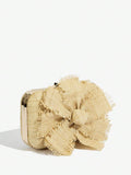 Close-up of raffia flower detail on elegant women's clutch