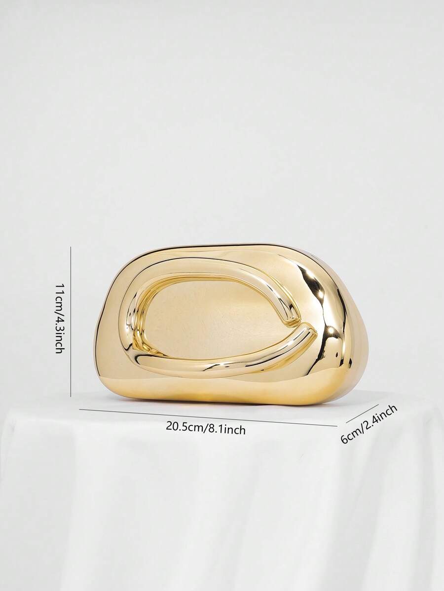 Add a splash of vintage charm to your night out with this Chic Retro Metal Decor Box Clutch. Perfectly sized for your essentials, its sleek metal design shines under party lights, making it the ultimate companion for cocktails and celebrations. Carry your style with a wink and a nod to retro elegance!