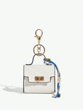 Close-up view of mini key ring holder keychain coin purse earphone pouch bag charm with chain strap, coin purse format, key ring detail for small-item storage